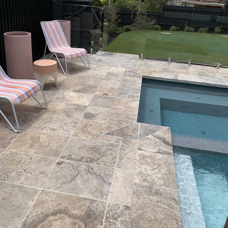 Backyard furniture collection with seating, table, and storage solutions.