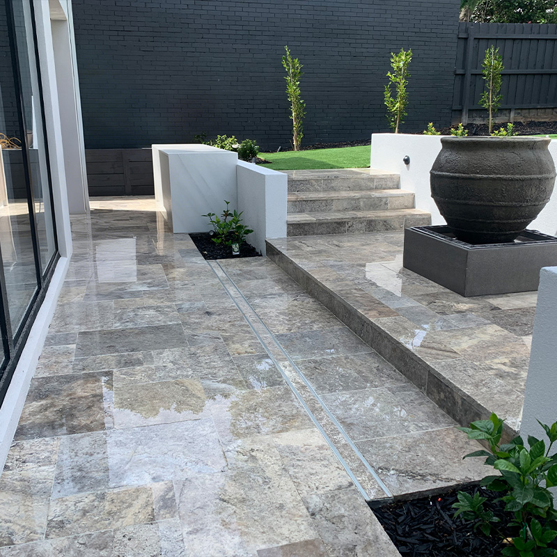 Backyard garden furniture arrangement with modular and durable pieces.