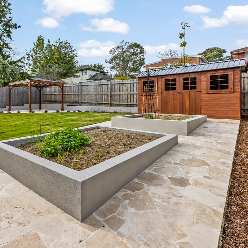 Decorative garden water feature enhancing landscape and patio aesthetics.
